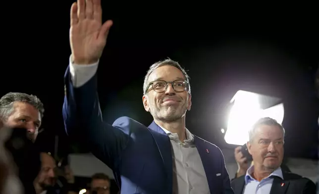 Herbert Kickl, leader of the Freedom Party of Austria waves to supporters, in Vienna, Austria, Sunday, Sept. 29, 2024, after polls closed in the country's national election. (AP Photo/Heinz-Peter Bader)