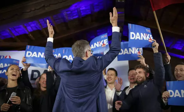 Herbert Kickl, leader of the Freedom Party of Austria cheers with supporters, in Vienna, Austria, Sunday, Sept. 29, 2024, after polls closed in the country's national election. (AP Photo/Heinz-Peter Bader)