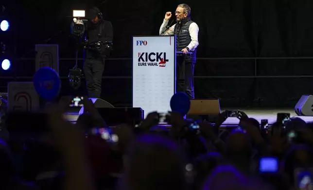 Herbert Kickl, leader of the Freedom Party of Austria, addresses supporters during thefinal rally of his electoral campaign, outside the St. Stephen Cathedral, in Vienna, Austria, Friday, Sept. 27, 2024, ahead of the country's national election which will take place on Sept. 29. (AP Photo/Andreea Alexandru)