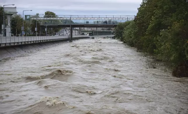 River Wien floods its banks in the west of Vienna, Austria, Sunday, Sept.15, 2024. (AP Photo/Heinz-Peter Bader)