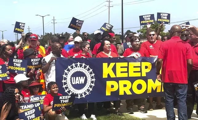 In this image from video, United Auto Workers members rally outside Stellantis' Sterling Heights Assembly Plant Friday, Aug. 23, 2024, in Sterling Heights, Mich. (AP Photo/Tom Krisher)