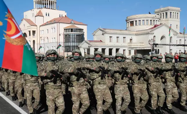 FILE - In this photo provided by the Azerbaijan's Presidential Press Office, Azerbaijani President Ilham Aliyev speaks at a parade in Khankendi, capital of the former breakaway territory of Karabakh, Azerbaijan, on Nov. 8, 2023. (Azerbaijani Presidential Press Office via AP, File)