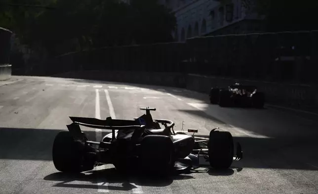 Ferrari driver Charles Leclerc of Monaco in action during a Formula One Grand Prix qualifying in Baku, Azerbaijan, on Saturday, Sept. 14, 2024. (AP Photo/Sergei Grits)