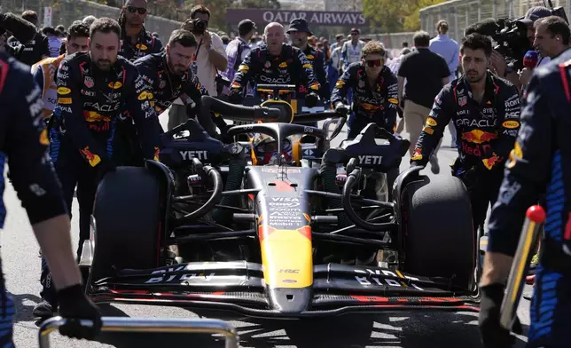 Red Bull driver Max Verstappen of the Netherlands is pushed on the grid before the Formula One Grand Prix in Baku, Azerbaijan, on Sunday, Sept. 15, 2024. (AP Photo/Sergei Grits)