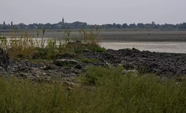 The dried out Rusanda salty lake, whose mud is used in medical therapy, near Melenci, Serbia, Wednesday, Sept. 4, 2024. Experts say the summer of 2024 in the Balkans was the hottest since measurements started more than 130 years ago. (AP Photo/Darko Vojinovic)