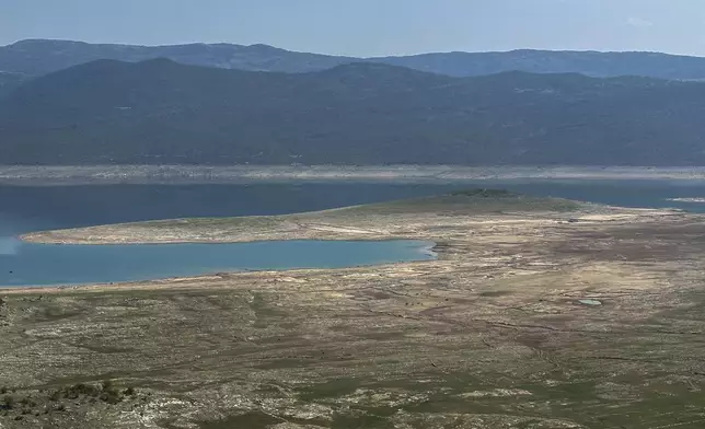 The dried out Bileca lake, near the town of Bileca, Bosnia, Thursday, Sept. 5, 2024. Experts say the summer of 2024 in the Balkans was the hottest since measurements started more than 130 years ago. (AP Photo/Eldar Emric)