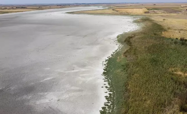 The dried up Rusanda salty lake, of which its mud is used in medical therapy, near Melenci, Serbia, Wednesday, Sept. 4, 2024. Experts say the summer of 2024 in the Balkans was the hottest since measurements started more than 130 years ago. (AP Photo/Darko Vojinovic)