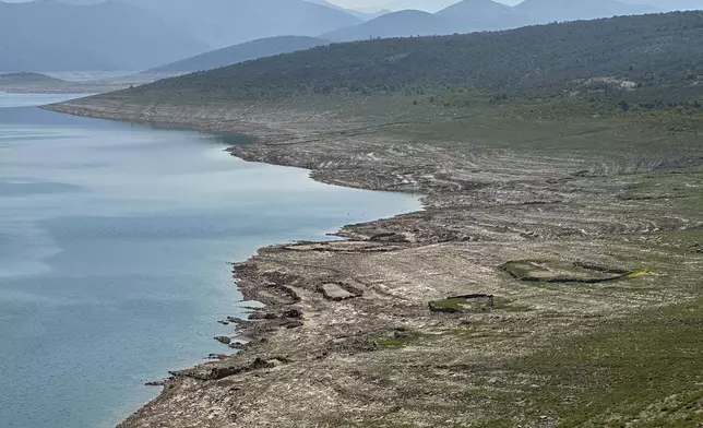 The dried out Bileca lake, near the town of Bileca, Bosnia, Thursday, Sept. 5, 2024. Experts say the summer of 2024 in the Balkans was the hottest since measurements started more than 130 years ago. (AP Photo/Eldar Emric)