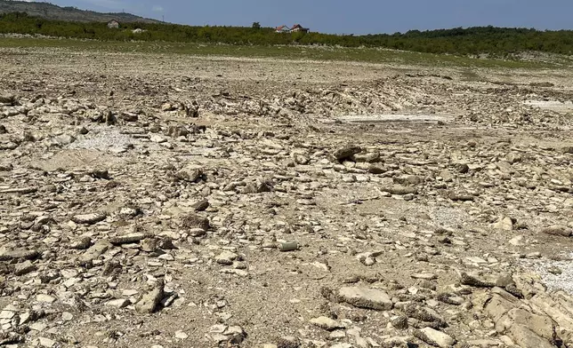 The dried out Bileca lake, near the town of Bileca, Bosnia, Thursday, Sept. 5, 2024. Experts say the summer of 2024 in the Balkans was the hottest since measurements started more than 130 years ago. (AP Photo/Eldar Emric)