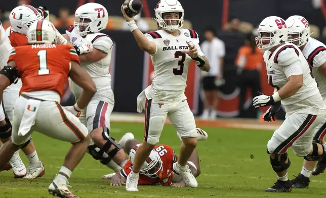 Ball State quarterback Kadin Semonza (3) throws during the first half of an NCAA football game against Miami, Saturday, Sept. 14, 2024, in Miami Gardens, Fla. (AP Photo/Lynne Sladky)