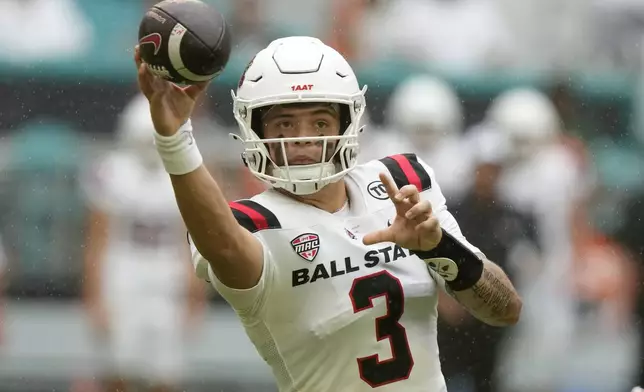 Ball State quarterback Kadin Semonza (3) throws during the first half of an NCAA football game against Miami, Saturday, Sept. 14, 2024, in Miami Gardens, Fla. (AP Photo/Lynne Sladky)