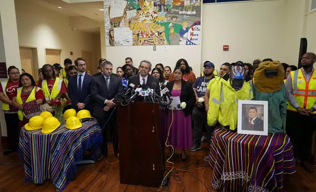 Gustavo Torres, executive director of advocacy organization CASA, speaks during a press conference among relatives of Miguel Luna, a worker who died during the collapse of Baltimore's Francis Scott Key Bridge, Tuesday, Sept. 17, 2024, in Baltimore. (AP Photo/Stephanie Scarbrough)