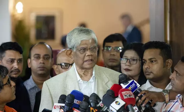 Dr. Salehuddin Ahmed, Adviser to Bangladesh's interim government's Ministry of Finance, center, speaks to media personnel after the signing of the 6th amendment of 'The Development Objective Grant Agreement (DOAG)' between US and Bangladesh, in Dhaka, Bangladesh, Sunday, Sept. 15, 2024. (AP Photo/Rajib Dhar)