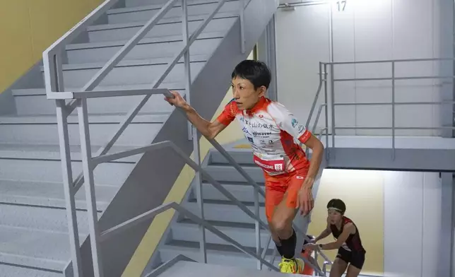 In this photo provided by ISF/Meeting, runner Yuri Yoshizumi competes during a race of Stairclimbing World Championships in Osaka, western Japan, on Nov. 19, 2023. (ISF/MEETING via AP)
