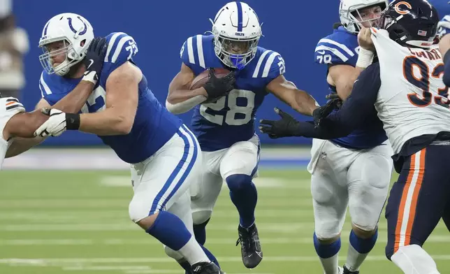 Indianapolis Colts running back Jonathan Taylor (28) runs against the Chicago Bears during the second half of an NFL football game Sunday, Sept. 22, 2024, in Indianapolis. (AP Photo/Darron Cummings)