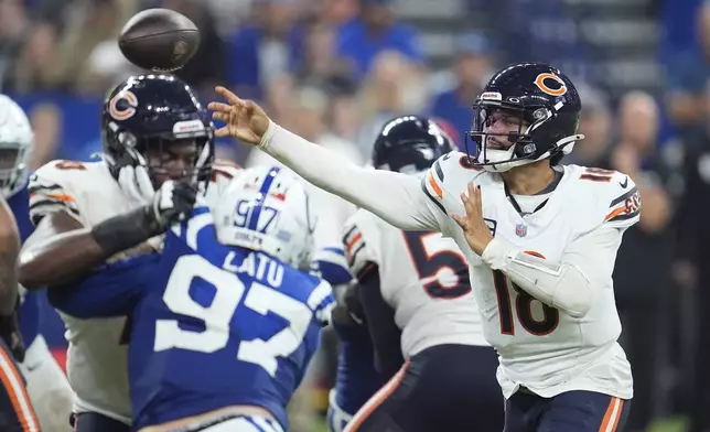 Chicago Bears quarterback Caleb Williams (18) throws a pass against the Indianapolis Colts during the second half of an NFL football game Sunday, Sept. 22, 2024, in Indianapolis. (AP Photo/Michael Conroy)