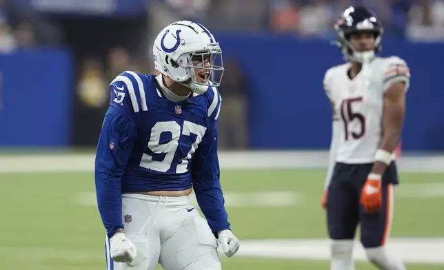 Indianapolis Colts defensive end Laiatu Latu (97) celebrates a play against the Chicago Bears during the second half of an NFL football game Sunday, Sept. 22, 2024, in Indianapolis. (AP Photo/Darron Cummings)