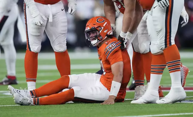 Chicago Bears quarterback Caleb Williams is slow to get up after being sacked by Houston Texans defensive end Will Anderson Jr. during the second half of an NFL football game Sunday, Sept. 15, 2024, in Houston. (AP Photo/Eric Gay)