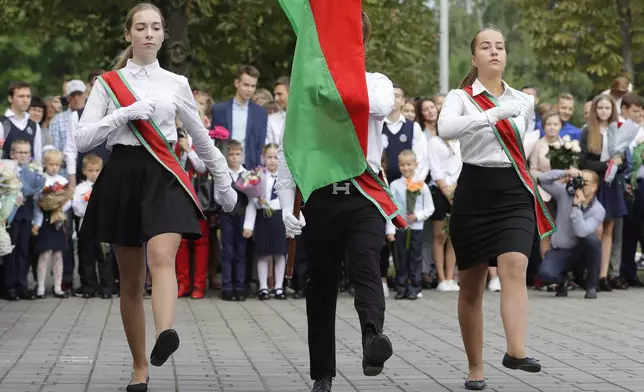 FILE - Schoolchildren march during the traditional opening of the school year, known as the Day of Knowledge, in Minsk, Belarus, on Sept. 1, 2018. (AP Photo, File)