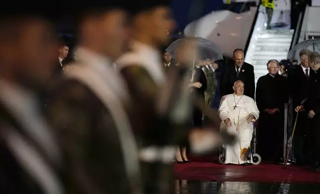 Pope Francis arrives at the Melsbroek air base in Steenokkerzeel, near Brussels, on the first day of his four-day visit to Luxembourg and Belgium, Thursday, Sept. 26, 2024. (AP Photo/Andrew Medichini)