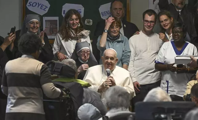 Pope Francis visits the Home Saint-Joseph for elderly people in Brussels during his four-day trip to Luxembourg and Belgium, Friday, Sept. 27, 2024. (Ciro Fusco/pool photo via AP)