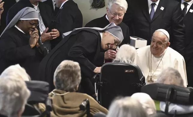 Pope Francis visits the Home Saint-Joseph for elderly people in Brussels during his four-day trip to Luxembourg and Belgium, Friday, Sept. 27, 2024. (Ciro Fusco/pool photo via AP)