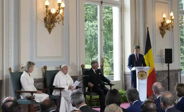 Pope Francis, Queen Mathilde and King Philippe listen to Belgium Prime Minister Alexander De Croo's address during a meeting with the authorities and the civil society in the Grande Galerie of the Castle of Laeken, Brussels, Friday, Sept. 27, 2024. (AP Photo/Andrew Medichini)