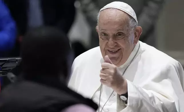 Pope Francis have a breakfast together with people who are experiencing homelessness and are assisted by the parish church of St. Gilles in Brussels, Saturday, Sept. 28, 2024. (AP Photo/Andrew Medichini)