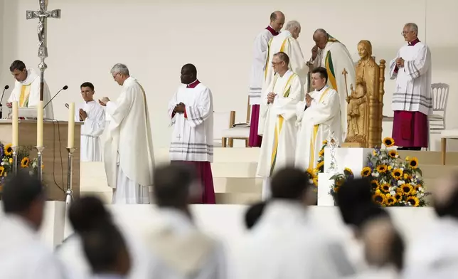 Pope Francis presides over the Sunday mass at King Baudouin Stadium, in Brussels Sunday, Sept. 29, 2024. (AP Photo/Omar Havana)