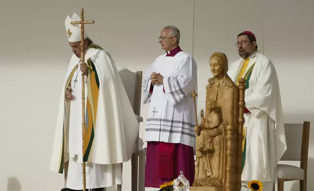 Pope Francis leaves at the end of the Sunday mass at King Baudouin Stadium, in Brussels Sunday, Sept. 29, 2024. (AP Photo/Omar Havana)