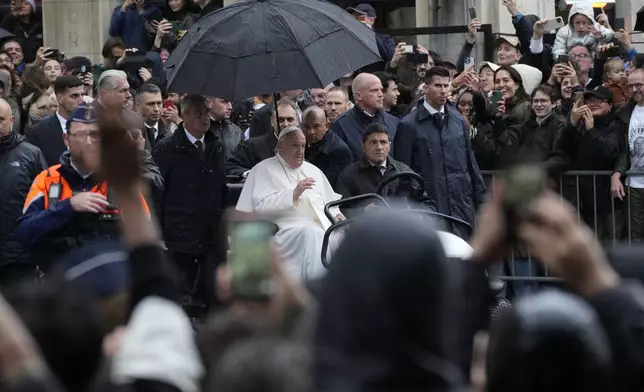 Pope Francis leaves after his meeting with the professors at the Catholic University of Leuven, Belgium, Friday, Sept. 27, 2024. (AP Photo/Andrew Medichini)