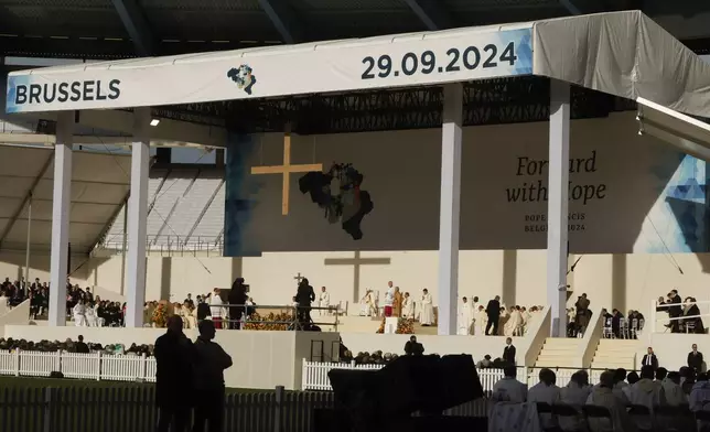 Pope Francis presides over the Sunday mass at King Baudouin Stadium, in Brussels Sunday, Sept. 29, 2024. (AP Photo/Omar Havana)