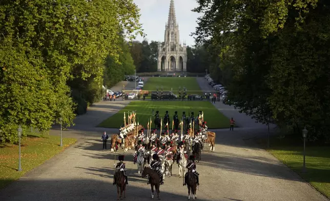 Belgian Royal Escort wait for the arrival of Pope Francis on the occasion of his visit to King Philippe and Queen Mathilde in the Castle of Laeken, Brussels, Friday, Sept. 27, 2024. (AP Photo/Andrew Medichini)