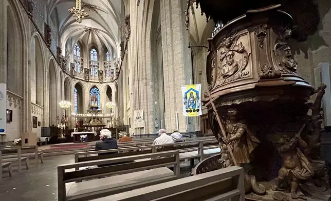 Parishioners wait for the start of a service at St. Martin's Basilica, in Halle, Belgium, Friday, Sept. 6, 2024. (AP Photo/Raf Casert)