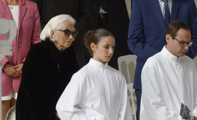 Queen Paola, mother of Queen Mathilde listens Pope Francis as he presides the holy mass , at the King Baudouin stadium in Brussels, Belgium, Sunday, Sept. 29, 2024. (AP Photo/Omar Havana)