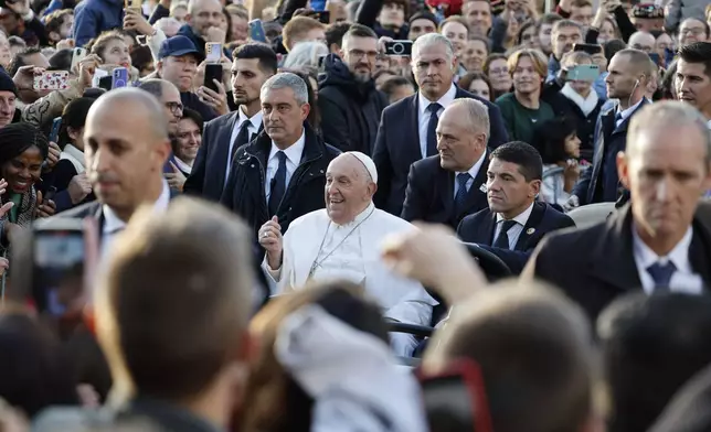 Pope Francis cheers faithful at the end of his meeting with students of the Louvain Catholic University in Ottignies-Louvain-la-Neuve, Belgium, Saturday, Sept. 28, 2024. (AP Photo/Geert Vanden Wijngaert)