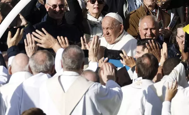 Pope Francis arrives to lead the holy mass , at the King Baudouin stadium in Brussels, Belgium, Sunday, Sept. 29, 2024. (AP Photo/Omar Havana)