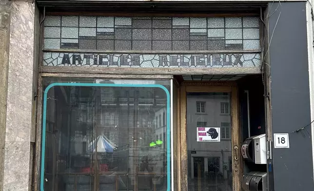 A view of an abandoned shop near St. Martin's Basilica which used to sell religious items, in Halle, Belgium, Sept. 6, 2024. (AP Photo/Raf Casert)