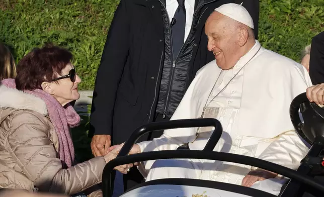 Pope Francis cheers faithful at the end of his meeting with students of the Louvain Catholic University in Ottignies-Louvain-la-Neuve, Belgium, Saturday, Sept. 28, 2024. (AP Photo/Geert Vanden Wijngaert)