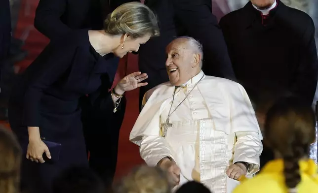 Pope Francis talks to Queen Mathilde of Belgium upon his arrival at the Melsbroek air base in Steenokkerzeel, near Brussels, on the first day of his four-day visit to Luxembourg and Belgium, Thursday, Sept. 26, 2024. (AP Photo/Geert Vanden Wijngaert)