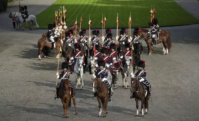 Belgian Royal Escort wait for the arrival of Pope Francis on the occasion of his visit to King Philippe and Queen Mathilde in the Castle of Laeken, Brussels, Friday, Sept. 27, 2024. (AP Photo/Andrew Medichini)