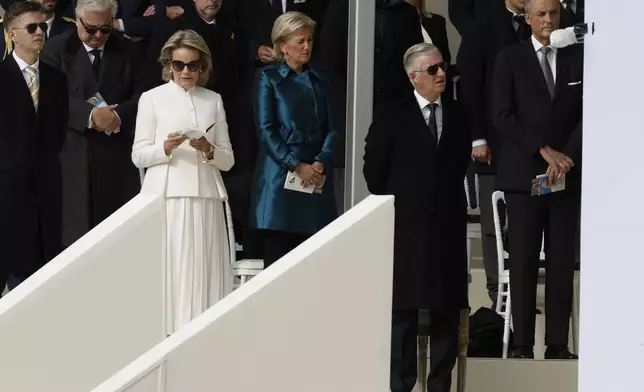 Queen Mathilde, left, and King Philippe listen Pope Francis as he presides the holy mass , at the King Baudouin stadium in Brussels, Belgium, Sunday, Sept. 29, 2024. (AP Photo/Omar Havana)