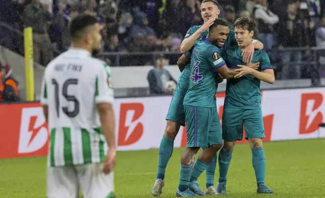 Anderlecht players celebrate after Anderlecht's Yari Verschaeren, not seen, scored his side's opening goal during the Europa League soccer match between Anderlecht and Ferencvaros in Anderlecht, Belgium, Wednesday, Sept. 25, 2024. (AP Photo/Francois Walschaerts)