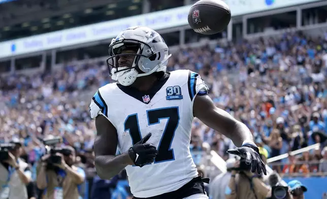 Carolina Panthers wide receiver Xavier Legette celebrates after scoring against the Cincinnati Bengals during the first half of an NFL football game, Sunday, Sept. 29, 2024, in Charlotte, N.C. (AP Photo/Erik Verduzco)