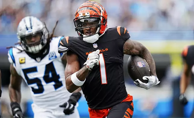 Cincinnati Bengals wide receiver Ja'Marr Chase runs for a touchdown against the Carolina Panthers during the first half of an NFL football game, Sunday, Sept. 29, 2024, in Charlotte, N.C. (AP Photo/Rusty Jones)