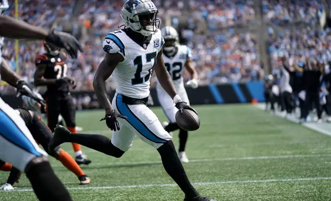 Carolina Panthers wide receiver Xavier Legette celebrates after scoring against the Cincinnati Bengals during the first half of an NFL football game, Sunday, Sept. 29, 2024, in Charlotte, N.C. (AP Photo/Erik Verduzco)