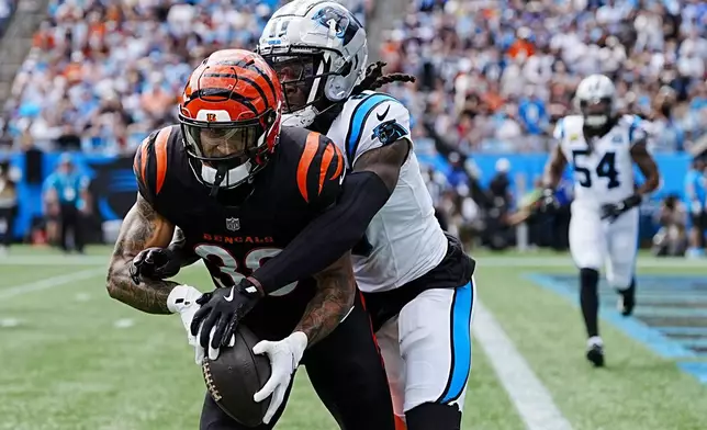 Carolina Panthers cornerback Jaycee Horn breaks up a pass intended for Cincinnati Bengals running back Chase Brown during the first half of an NFL football game, Sunday, Sept. 29, 2024, in Charlotte, N.C. (AP Photo/Rusty Jones)