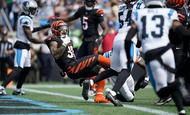 Cincinnati Bengals running back Chase Brown scores against the Carolina Panthers during the first half of an NFL football game, Sunday, Sept. 29, 2024, in Charlotte, N.C. (AP Photo/Erik Verduzco)