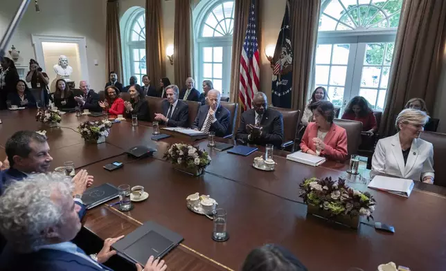 President Joe Biden, back row, center, speaks during a meeting with the members of his cabinet and first lady Jill Biden, in the Cabinet Room of the White House, Friday, Sept. 20, 2024. (AP Photo/Manuel Balce Ceneta)