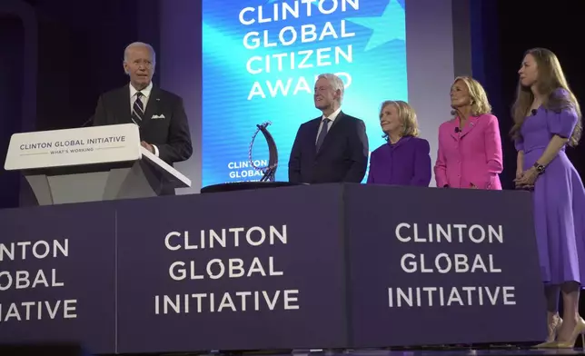 President Joe Biden speaks as he presented with the Global Citizen Award by former President Bill Clinton, former Secretary of State Hillary Clinton, first lady Jill Biden and Chelsea Clinton at the Clinton Global Initiative Monday, Sept. 23, 2024, in New York. (AP Photo/Manuel Balce Ceneta)